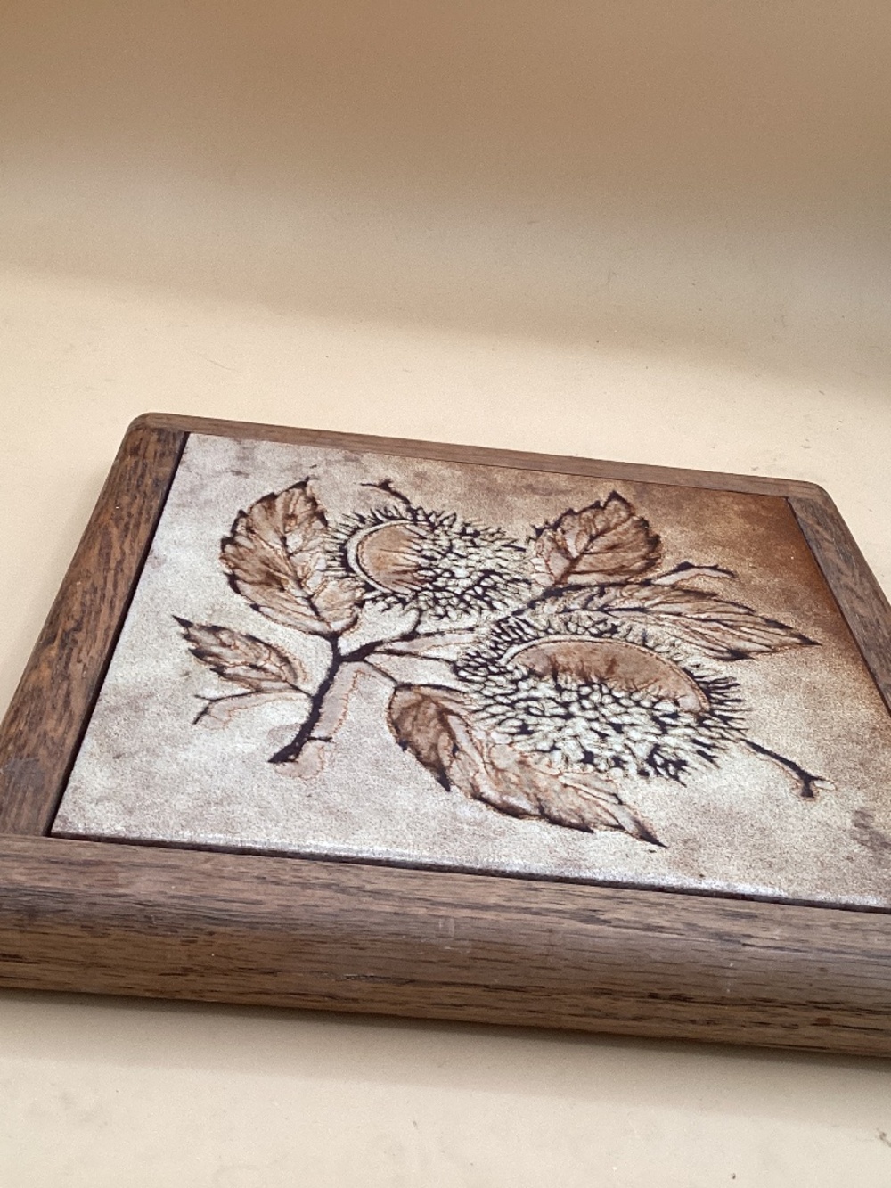 Vintage wooden framed ceramic tile, botanical chestnut branch and leaf